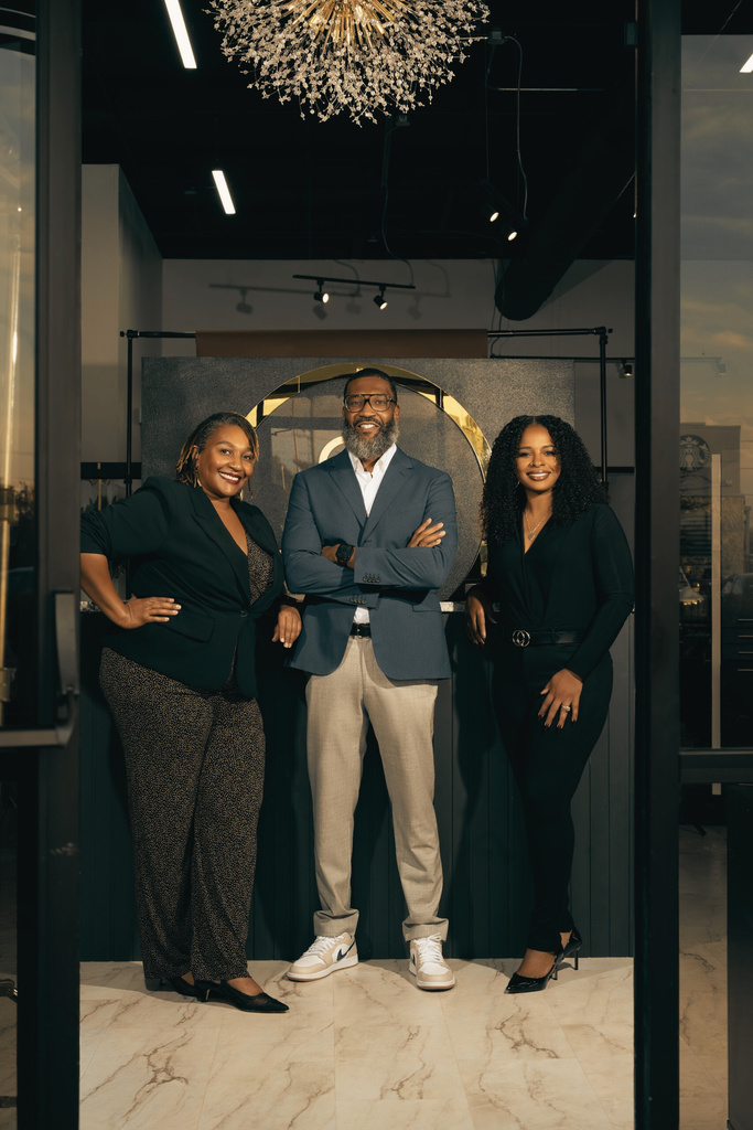 Tiffany Wilson with team members inside the expanded 29Eleven luxury salon space